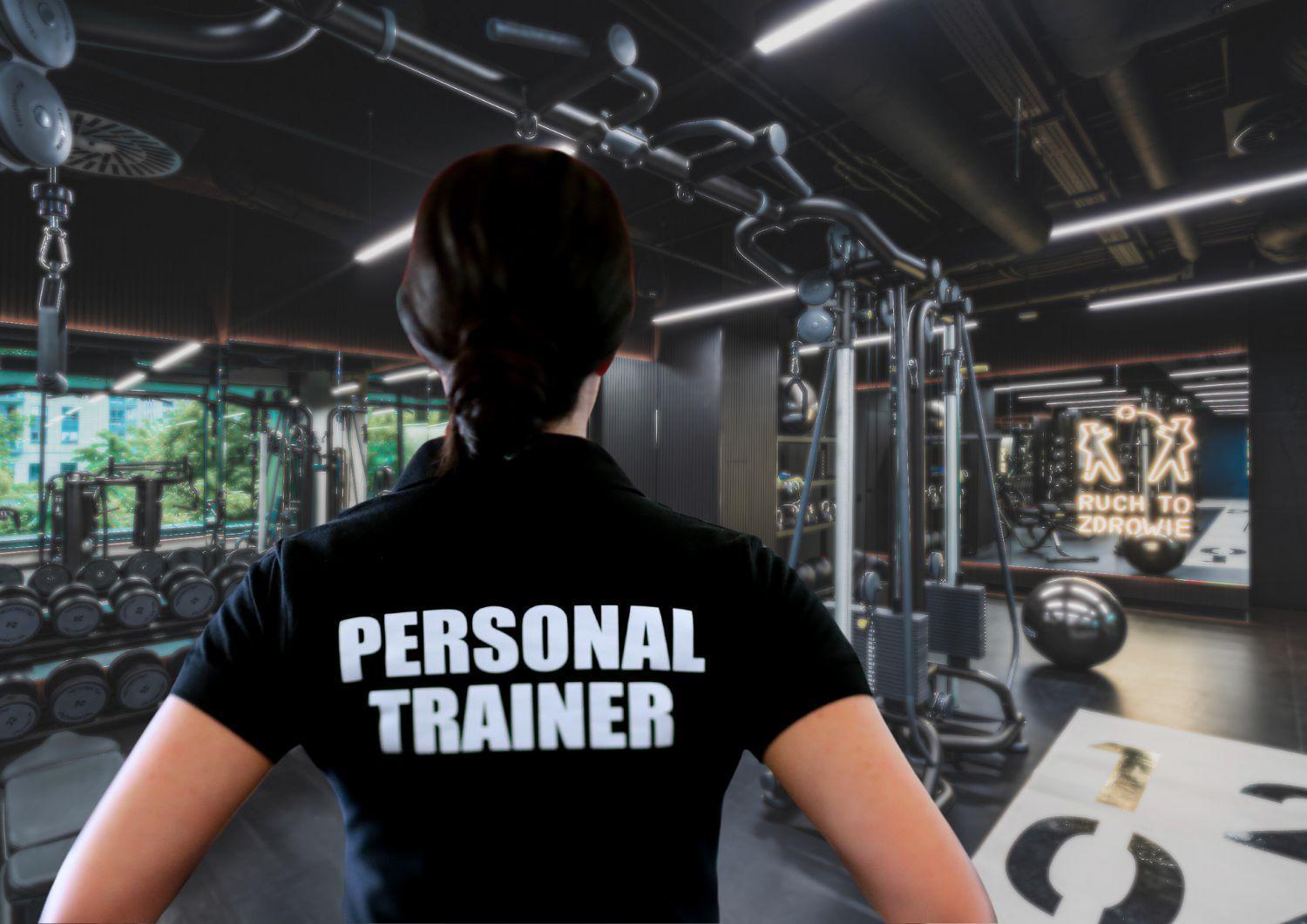 Апарт отель Royal Tulip Warsaw Centre Экстерьер фото The image shows the back of a person wearing a black shirt with the words "PERSONAL TRAINER" printed in large white letters. The setting appears to be a gym, featuring various workout equipment and weightlifting machines in the background. There are 